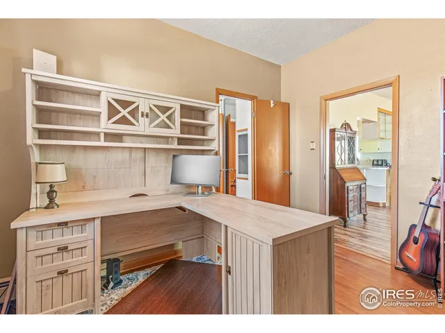 a room with a bed and a table in it