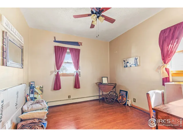 a living room with furniture and a dining table