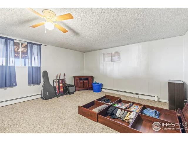 a view of a garage with a lot of stuff