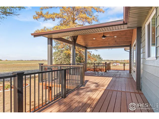 a view of a balcony with wooden floor