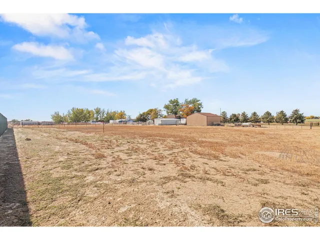 an aerial view of a house with a ocean view