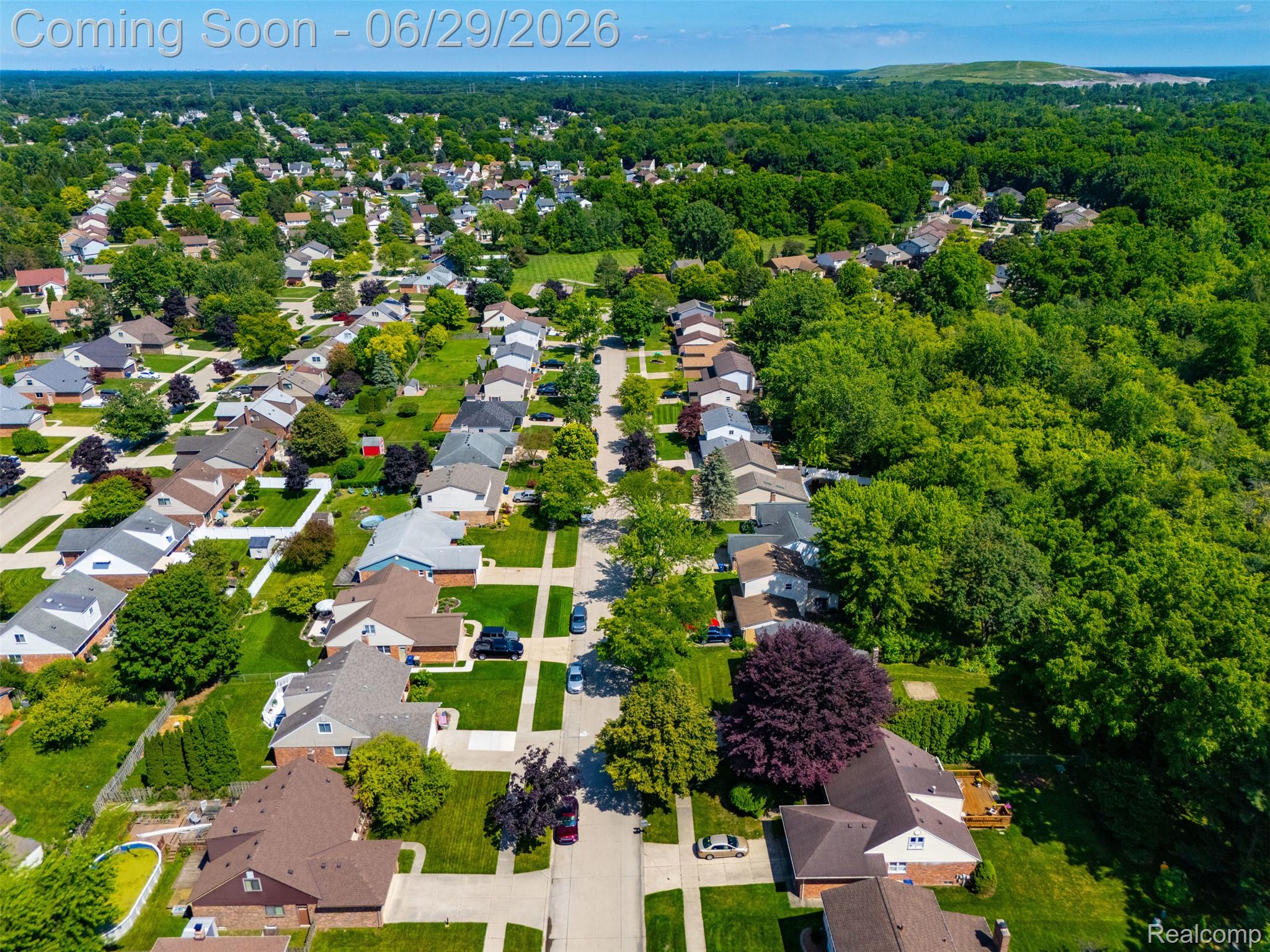 45179 Rudgate Road Canton, MI 48188 - Photo 46 of 48 Residential neighborhood with extensive tree coverage and individual properties featuring diverse rooflines and well-maintained lawns