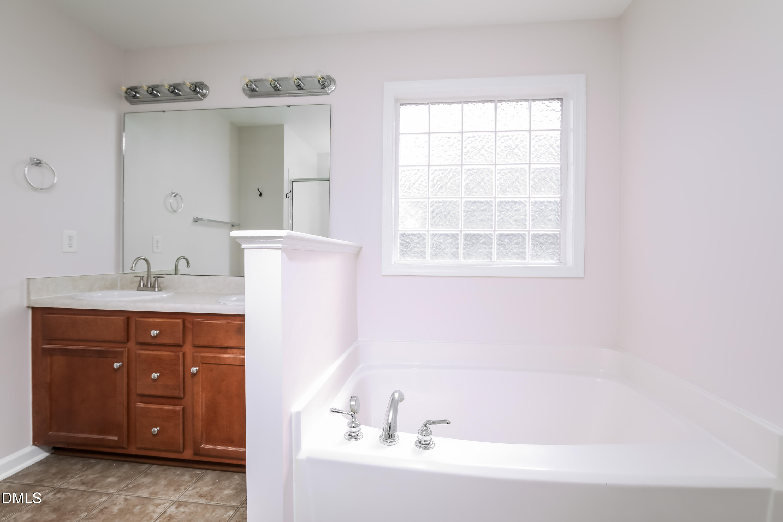 40 Broadhead Court Angier, NC 27501 - Photo 13 of 20 a bathroom with a sink and a bathtub