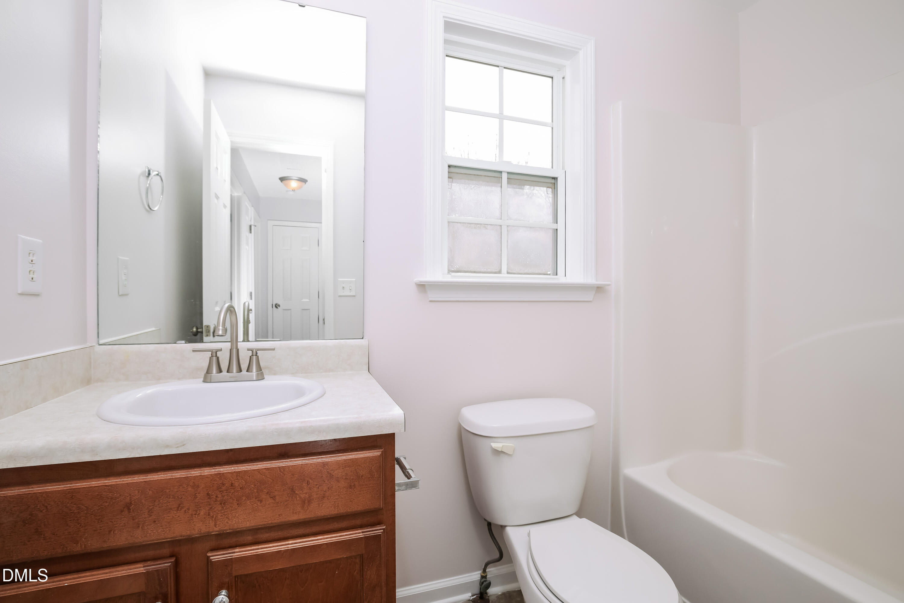 40 Broadhead Court Angier, NC 27501 - Photo 17 of 20 a bathroom with a sink toilet vanity and tub