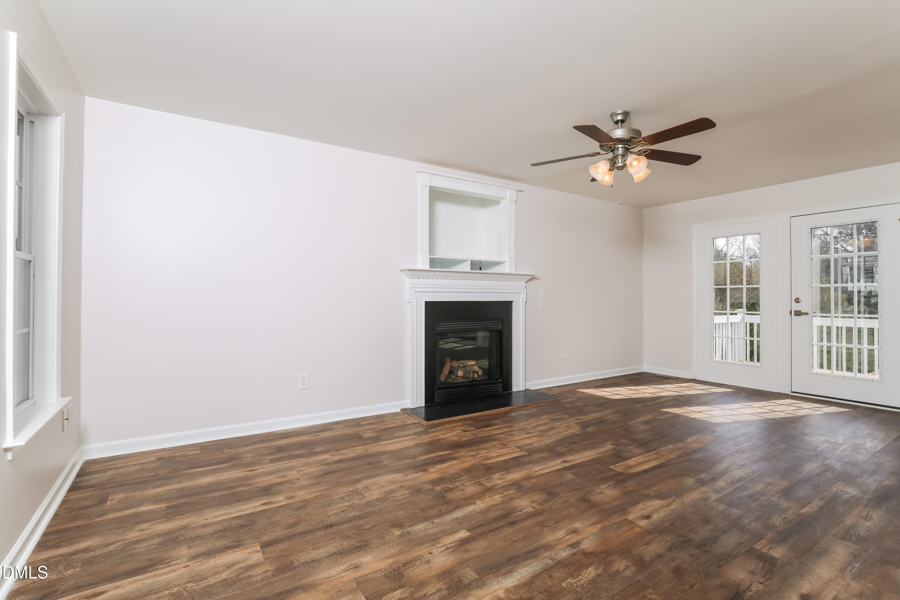 40 Broadhead Court Angier, NC 27501 - Photo 4 of 20 a view of empty room with a fireplace and wooden floor