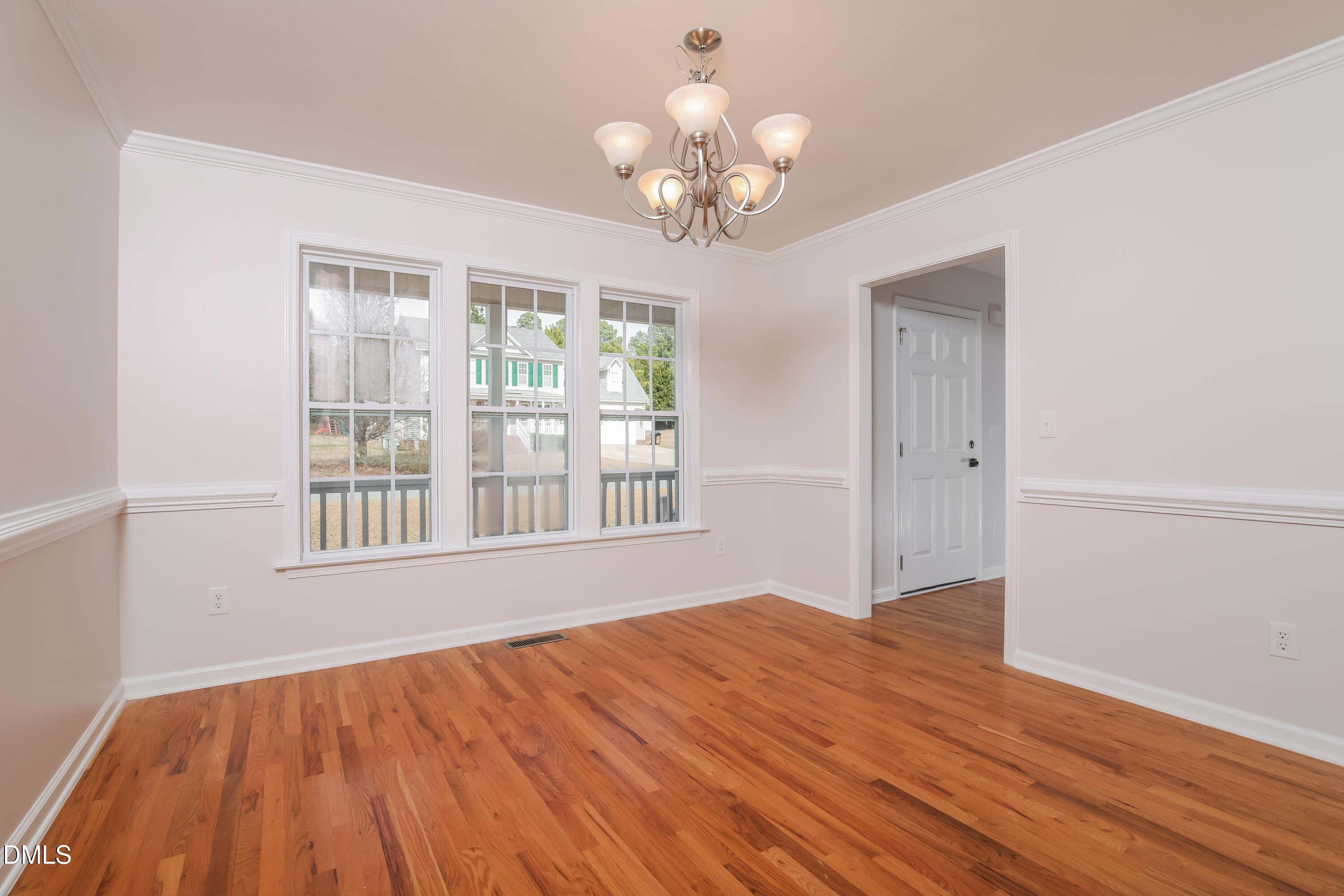 40 Broadhead Court Angier, NC 27501 - Photo 5 of 20 a view of an empty room with wooden floor and a window