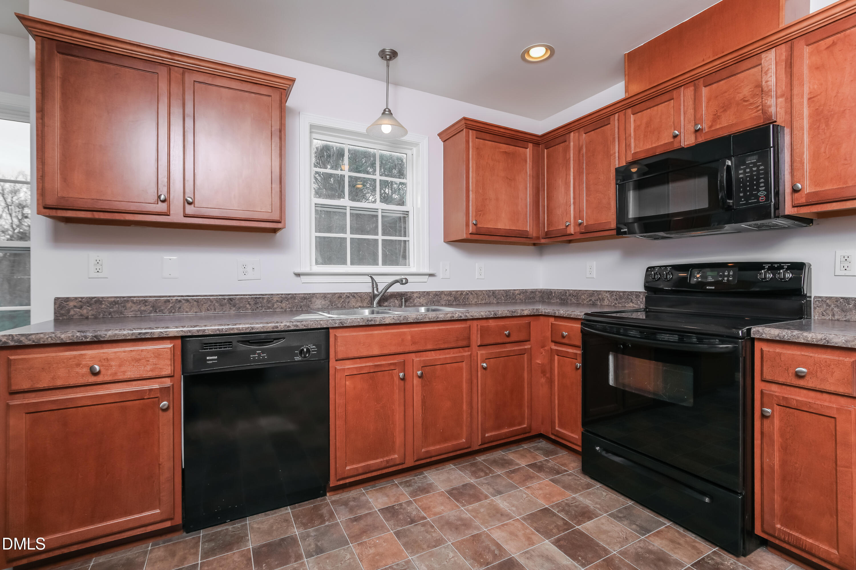 40 Broadhead Court Angier, NC 27501 - Photo 8 of 20 a kitchen with stainless steel appliances granite countertop a stove top oven a sink dishwasher and a microwave oven on the blue kitchen countertops