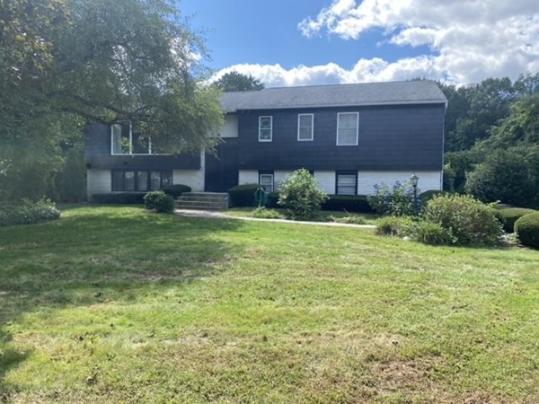 25 Andover Road Longmeadow, MA 01106 - Photo 1 of 2 a view of a brick house with a yard