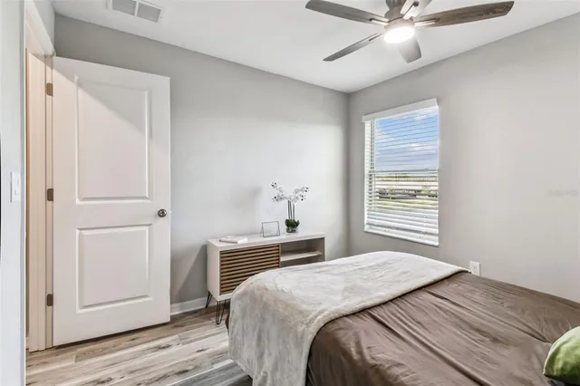 a bedroom with a bed and dresser