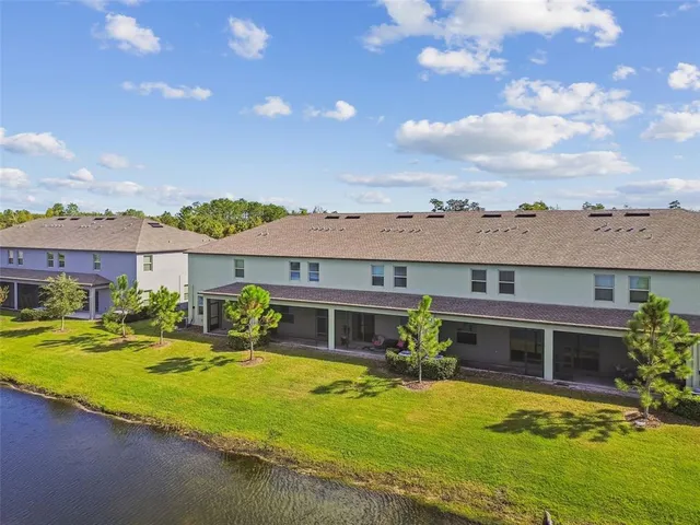 a view of an house with swimming pool and porch