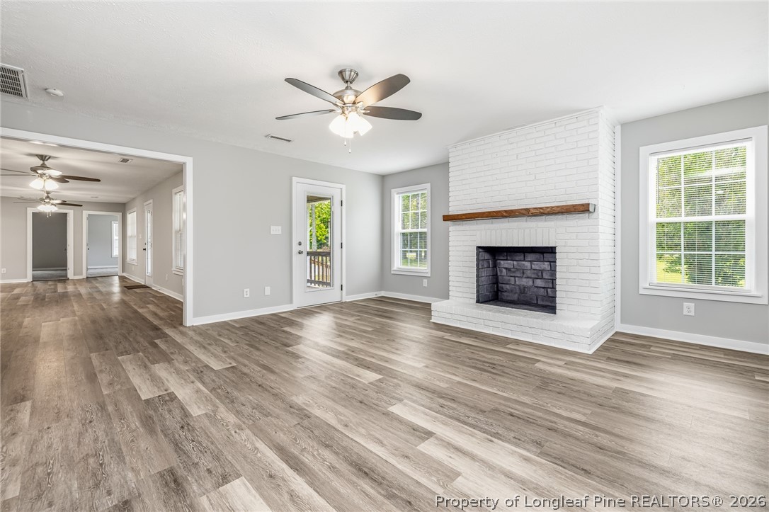 3524 Pine Log Road Lumberton, NC 28360 - Photo 27 of 42 a view of an empty room with a fireplace and a window
