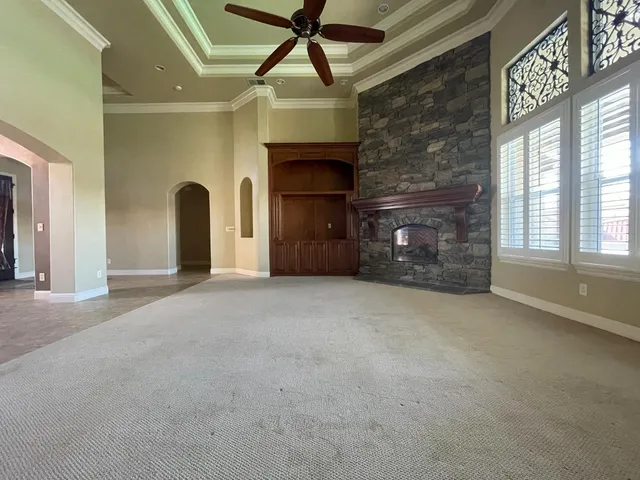 a kitchen with stainless steel appliances granite countertop a sink a stove and a refrigerator