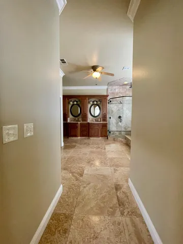 a bed sitting in a room next to a window