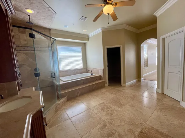 an outdoor space with furniture and umbrella