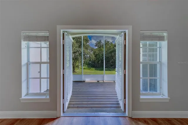 a view of a room with deck and a yard