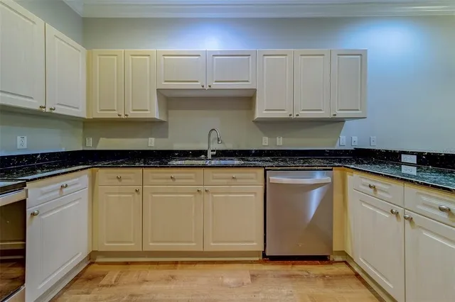 a white toilet sitting next to a white sink