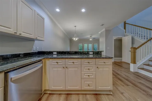 an empty room with closet and ceiling fan