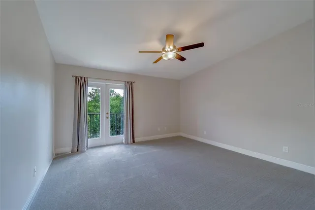 a bathroom with a granite countertop sink double mirror and a shower