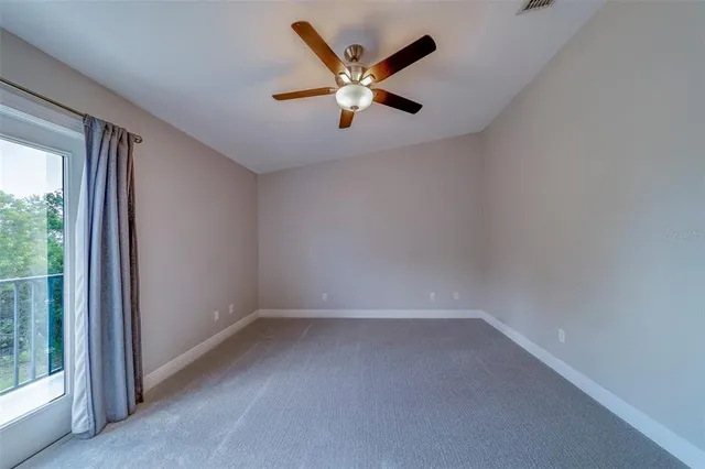 a bathroom with a bath tub with a shower