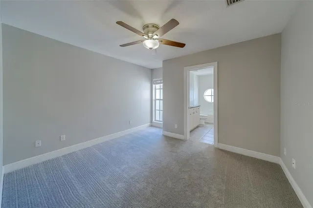 a view of a house with a swimming pool and sitting area