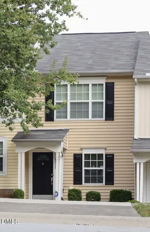 a front view of a building with a parking space