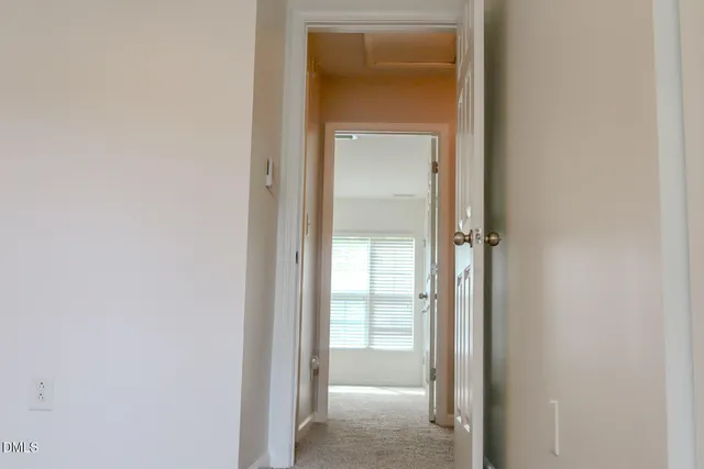 a view of a bathroom from a hallway