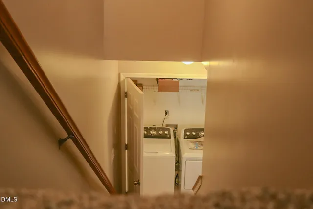 a bathroom with a shower and a door