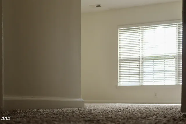 a view of a window in an empty room