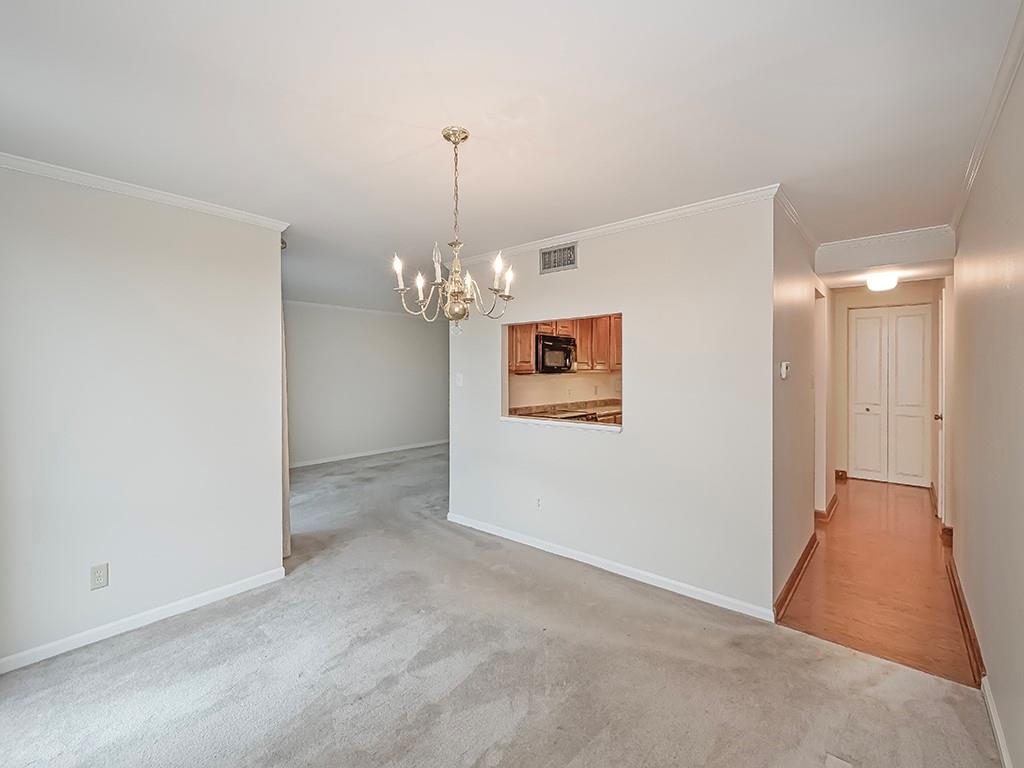900 Washington Road, Unit 512 Pittsburgh, PA 15228 - Photo 11 of 29 a view of a hallway with a chandelier