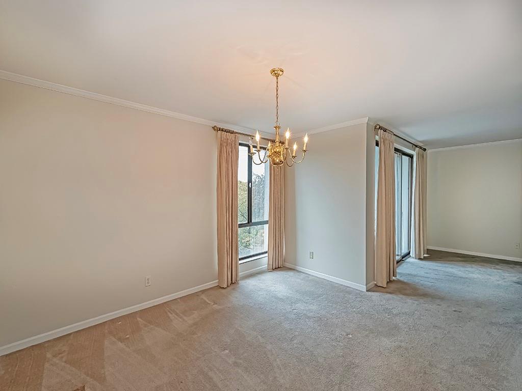 900 Washington Road, Unit 512 Pittsburgh, PA 15228 - Photo 12 of 29 a view of a chandelier in an empty room