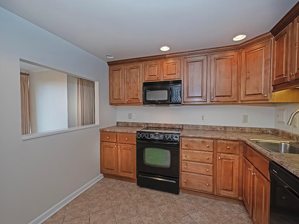 900 Washington Road, Unit 512 Pittsburgh, PA 15228 - Photo 13 of 29 a kitchen with stainless steel appliances granite countertop a stove and a sink