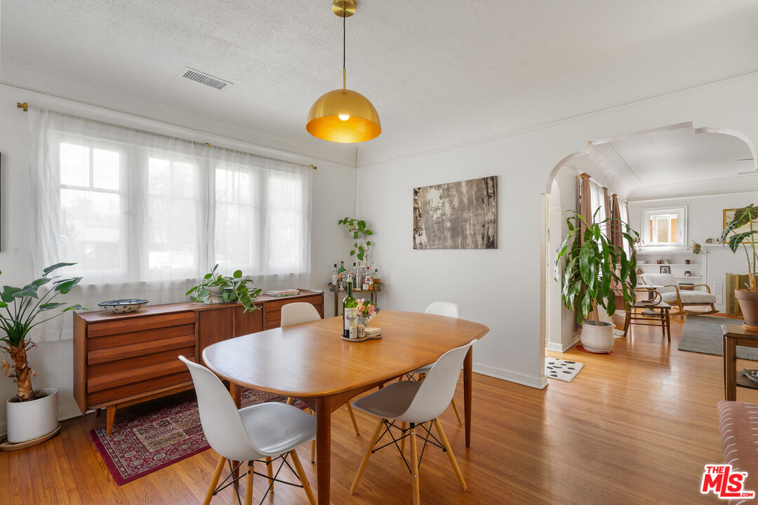 1955 Garfield Avenue Pasadena, CA 91104 - Photo 11 of 55 a dining room with furniture and wooden floor