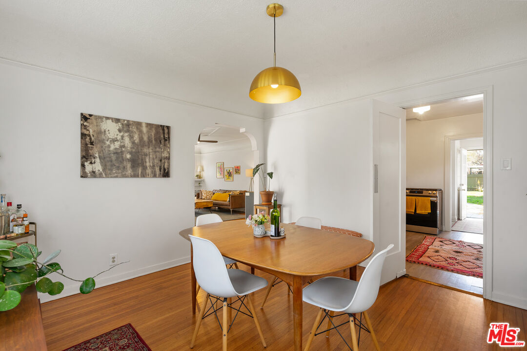 1955 Garfield Avenue Pasadena, CA 91104 - Photo 13 of 55 a view of a dining room with furniture and wooden floor