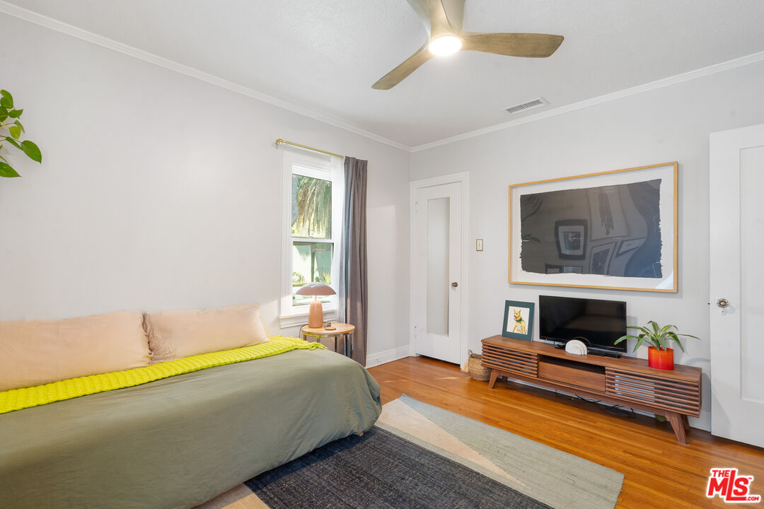 1955 Garfield Avenue Pasadena, CA 91104 - Photo 29 of 55 a bedroom with furniture fireplace and window