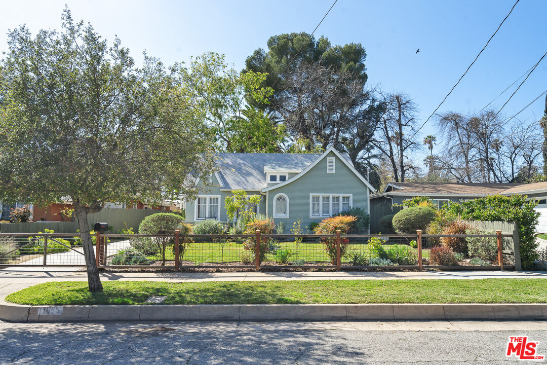 1955 Garfield Avenue Pasadena, CA 91104 - Photo 3 of 55 a front view of a house with a garden and trees