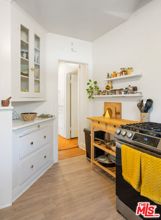 1955 Garfield Avenue Pasadena, CA 91104 - Photo 34 of 55 a kitchen with stainless steel appliances a stove and a refrigerator