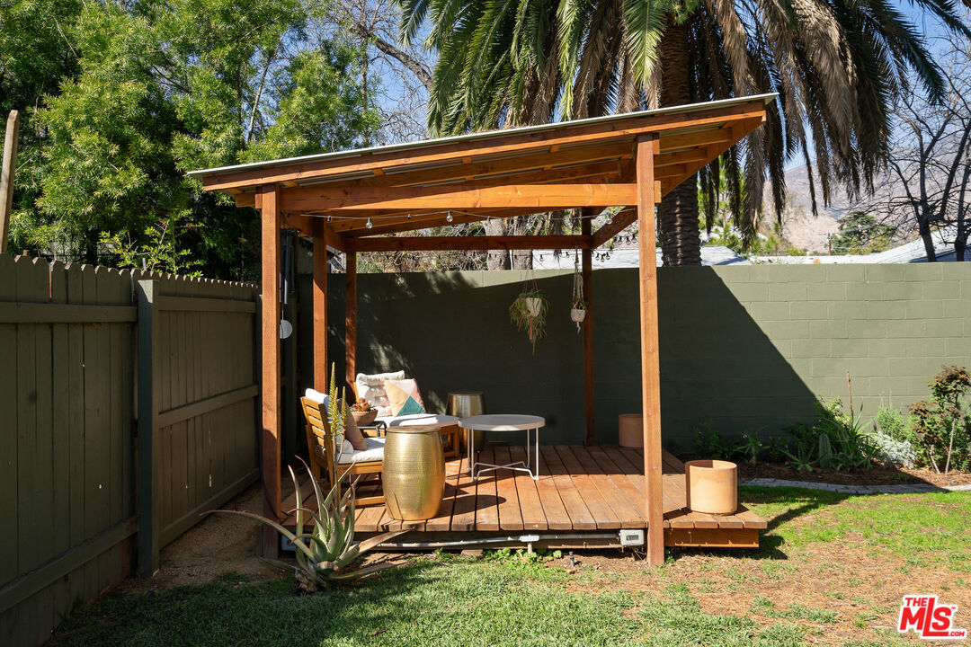 1955 Garfield Avenue Pasadena, CA 91104 - Photo 47 of 55 a view of backyard with wheel chair potted plants and large tree