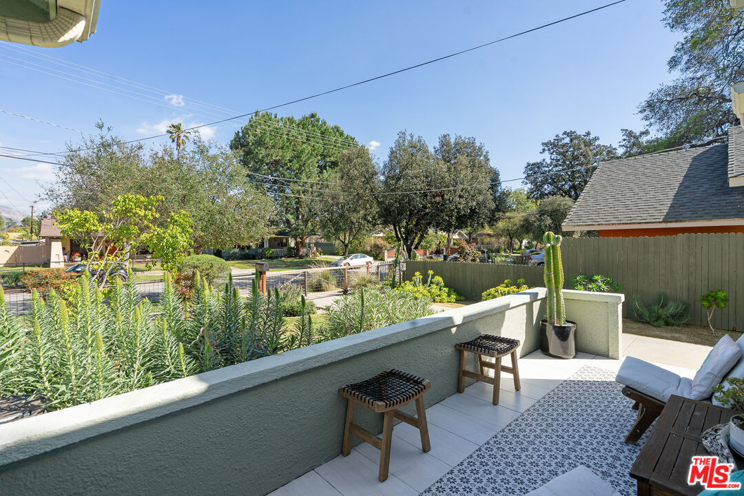 1955 Garfield Avenue Pasadena, CA 91104 - Photo 7 of 55 a view of a chairs and table in patio with a lake view