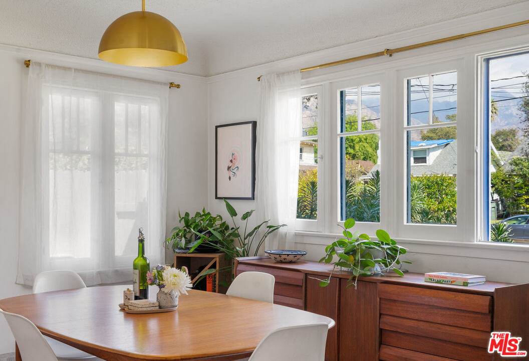 1955 Garfield Avenue Pasadena, CA 91104 - Photo 10 of 55 a dining room with furniture and wooden floor