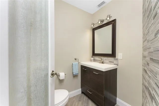a bathroom with a double vanity sink mirror and double