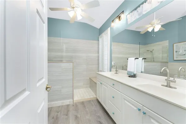 a view of a swimming pool with a chair and table in the patio