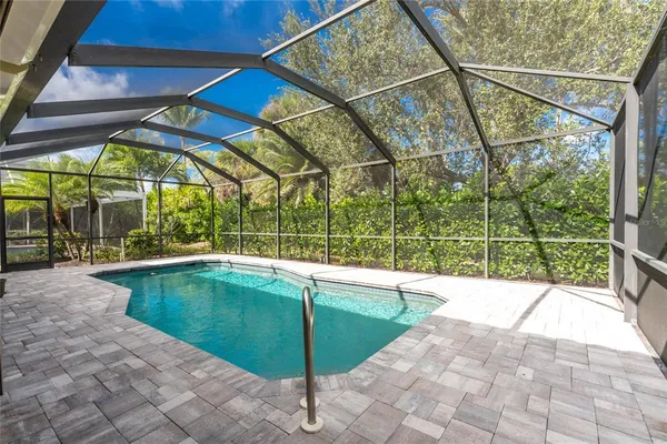 a view of a swimming pool with a patio