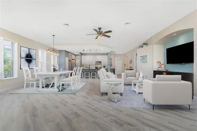 a view of a dining room with furniture window and wooden floor