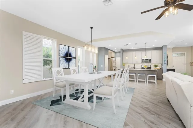 a living room with furniture and kitchen view