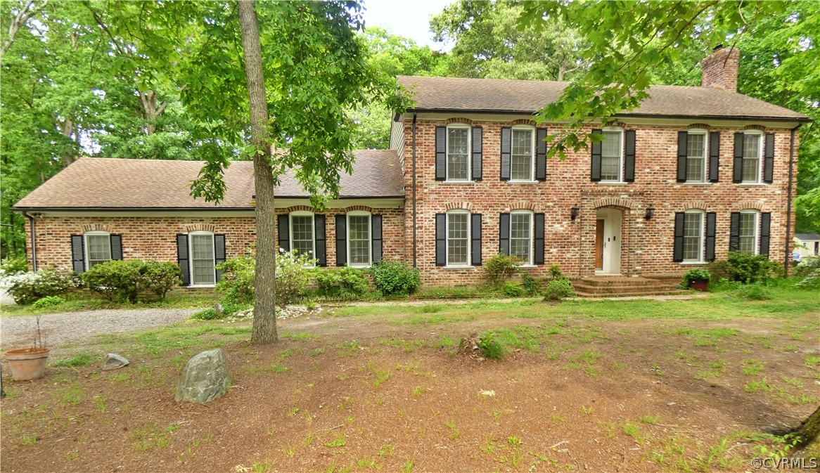 14011 Chepstow Road Midlothian, VA 23113 - Photo 2 of 49 a front view of a house with a yard and trees