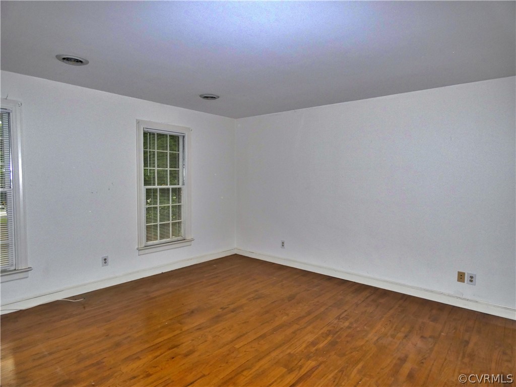 14011 Chepstow Road Midlothian, VA 23113 - Photo 27 of 49 an empty room with wooden floor and windows