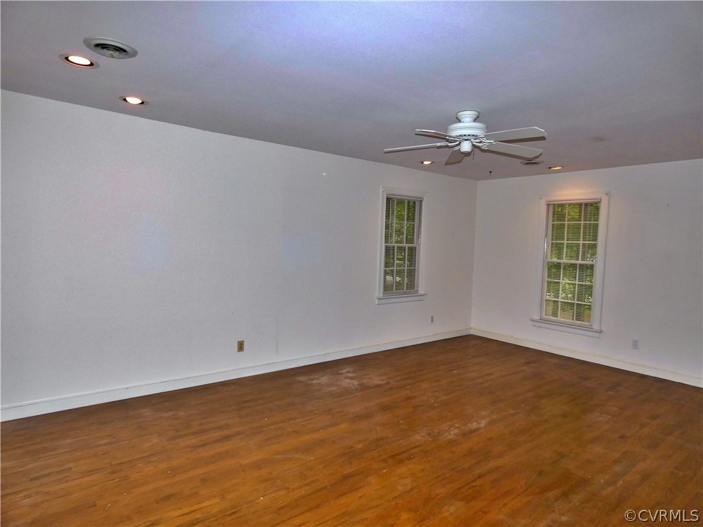 14011 Chepstow Road Midlothian, VA 23113 - Photo 33 of 49 an empty room with windows and chandelier fan