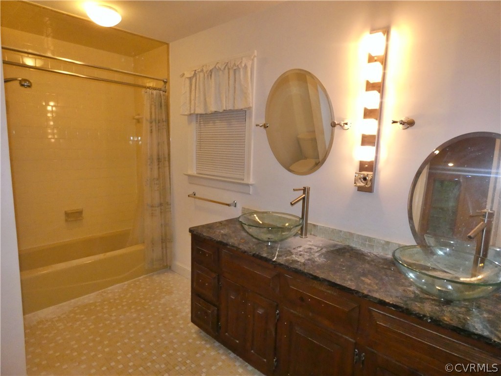 14011 Chepstow Road Midlothian, VA 23113 - Photo 40 of 49 a bathroom with a granite countertop sink a mirror and shower