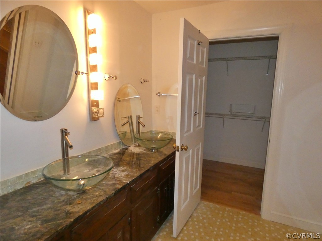 14011 Chepstow Road Midlothian, VA 23113 - Photo 41 of 49 a bathroom with a granite countertop sink and a mirror