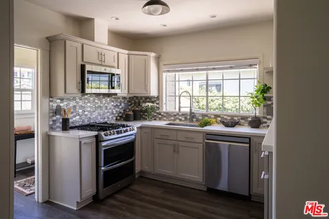 a kitchen with a stove and a sink